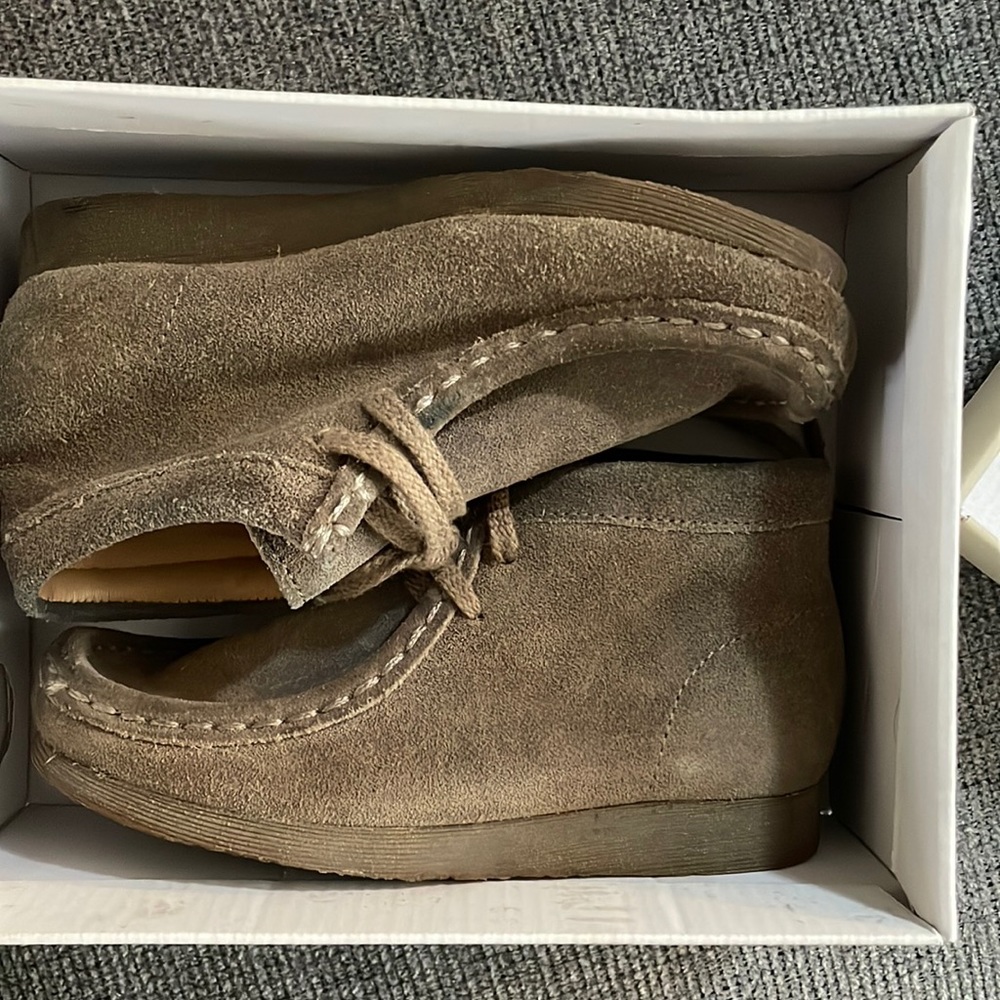 Taupe distressed colored wallabies.